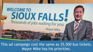 Sioux Falls Mayor Mike Huether would rather pay for big ads with his face on them than bus tickets for kids.