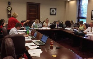 Secretary of State Shantel Krebs (in red) and team scrutinize SB 177 referendum petitions. Photo from @SOSKrebs, tweeted 2015.06.30