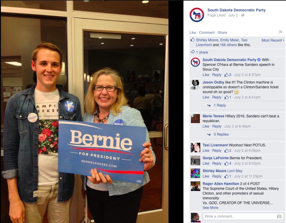SDDP chair Ann Tornberg holds a "Bernie for President" sign—Ann! You know they're talking Sanders, not Hunhoff, right? (SDDP Facebook page, Sioux City, IA, 2015.07.02)