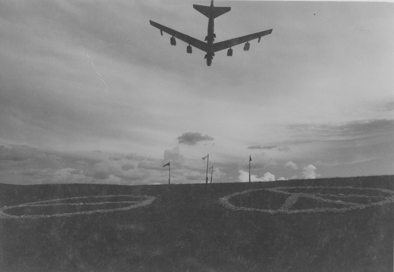 B-52 from Ellsworth Air Force Base flies over rock protest symbols on Marvin Kammerer's Meade County ranch. Photo by Don Polovich, Rapid City Journal staff, 1980.