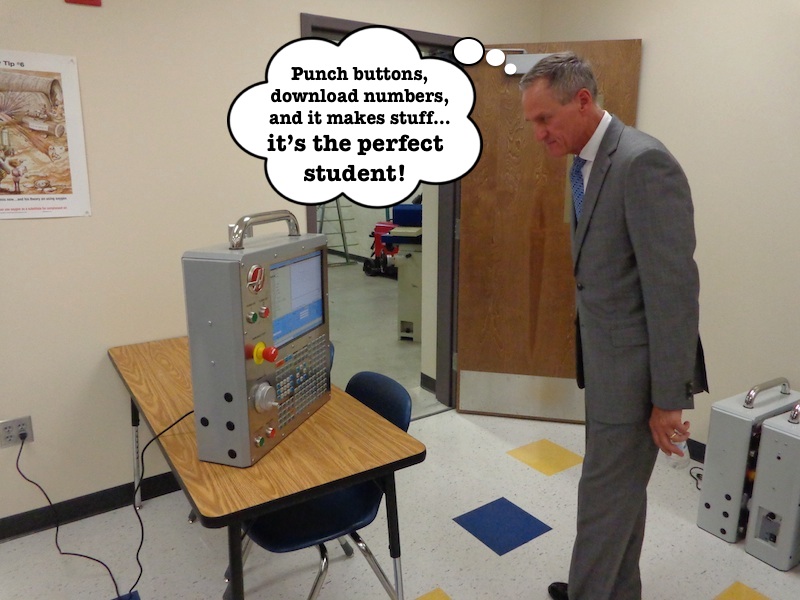 Governor Daugaard inspects CNC machine.