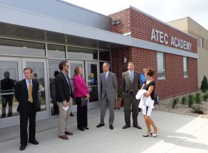 Mayor Mike Levsen, A-TEC lead architect Tom Hurlbert, Superintendent Becky Guffin, Governor Dennis Daugaard, chief of staff Tony Venhuizen, and Secretary of Education Melody Schopp discuss the new A-TEC Academy.