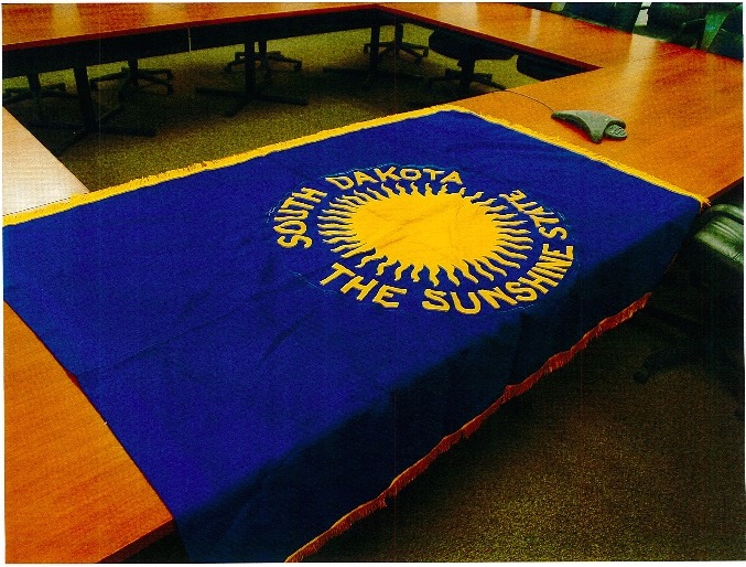 Original South Dakota state flag—obverse, commissioned 1909, stolen January 2015, recovered October 2015. Photo courtesy South Dakota Attorney General's office.