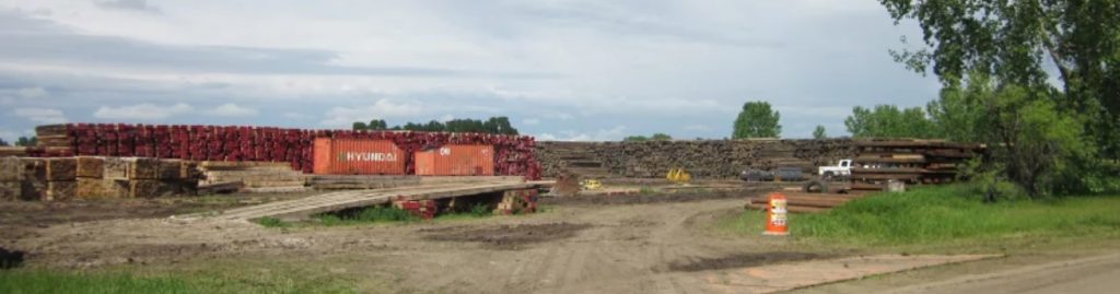 Stockpile of planks for temporary roads at Huron staging area for Dakota Access pipeline. Photo: Mary Lou Davis, 2016.05.27.