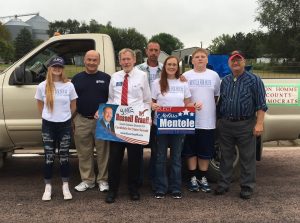 District 19 Senate candidate Russell Graeff (red tie) marches in the Wagner Labor Day parade with U.S. Senate candidate Jay Williams (2nd from left), District 19 House candidate Melissa Mentele (3rd from right), and Bon Homme County Democrats chairman Frank Kloucek (end right), as well as Mentele's family.