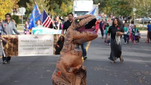 Brooks Briscoe recruited local actor Kurt Dean to march in full dinosaur regalia. Obviously, Kurt symbolizes the impending obsolesence of the SDGOP's one-party rule.