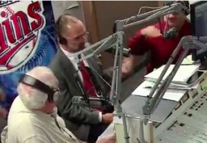 Al Novstrup makes a strange throat-slashing gesture as I explain why a boycott is a reasonable moral response to legislators' attempt to discriminate against customers based on religious beliefs. Screen cap from KSDN podcast, 2016.11.04.