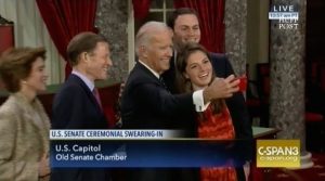 Vice-President Joe Biden snaps another selfie during Senate swearings-in. Screen cap from C-SPAN, 2017.01.03.