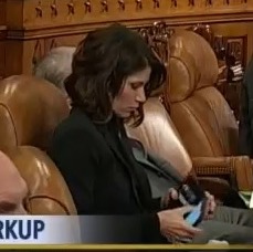 Rep. Kristi Noem, paying attention to her phone during discussion of the American Health Care Act, 2017.03.08. Screen cap from C-SPAN3.