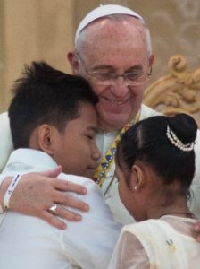 Pope Francis embraces abandoned children—photo by Paul Allyson Quiambao, 2015.