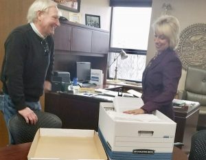 Smiles four months ago, but not today. Redistricting petition sponsor Charles Parkinson submits ~34,000 signatures to Secretary of State Shantel Krebs, 2017.11.08. Photo from Secretary of State's Office.