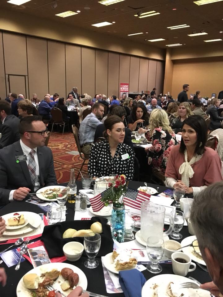 That's Dan Kaiser and, I believe, his wife Laura, sitting next to Kristi Noem. Photo from Brown County Republicans, Facebook post, 2018.04.05.
