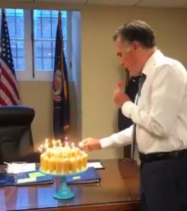 Senator Mitt Romney blows out candles on his Twinkie birthday cake, 2019.03.12.