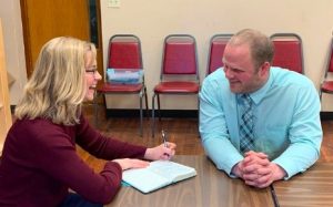 Rep. Scyller Borglum discusses rural education with Colome superintendent Ryan Orrock; from BorglumSD Facebook page, 2019.04.02.