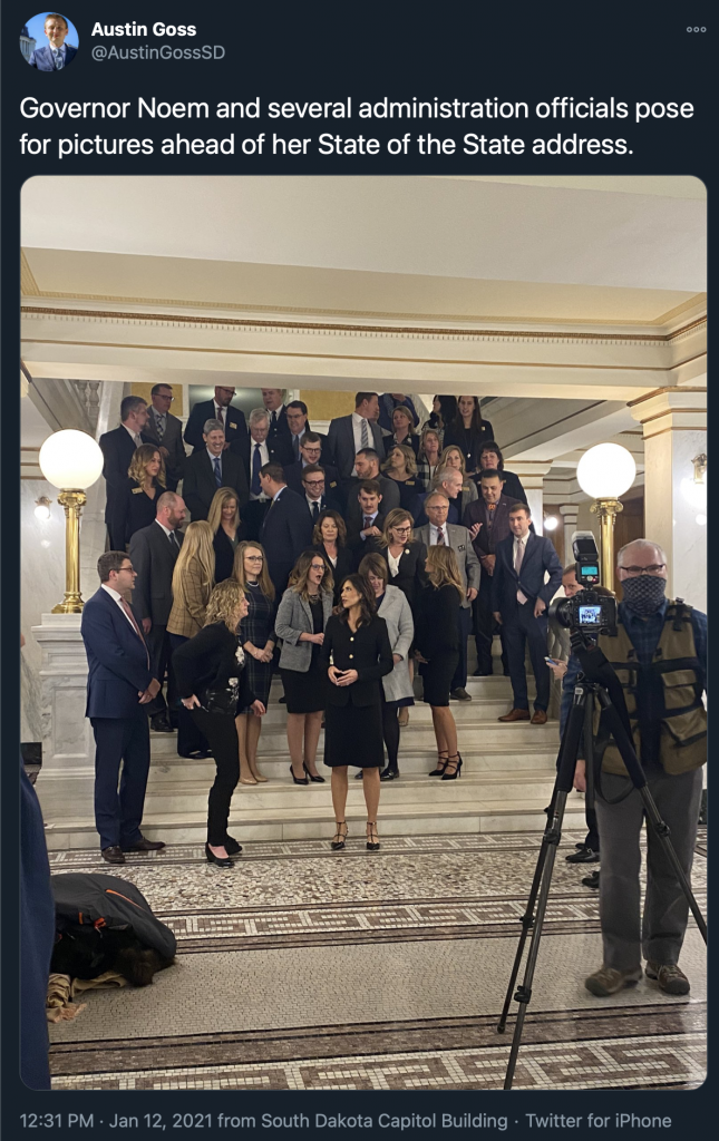 Austin Goss, photo of Governor Kristi Noem and administration officials indoors and maskless at SD Capitol, Twitter, 2021.01.12.