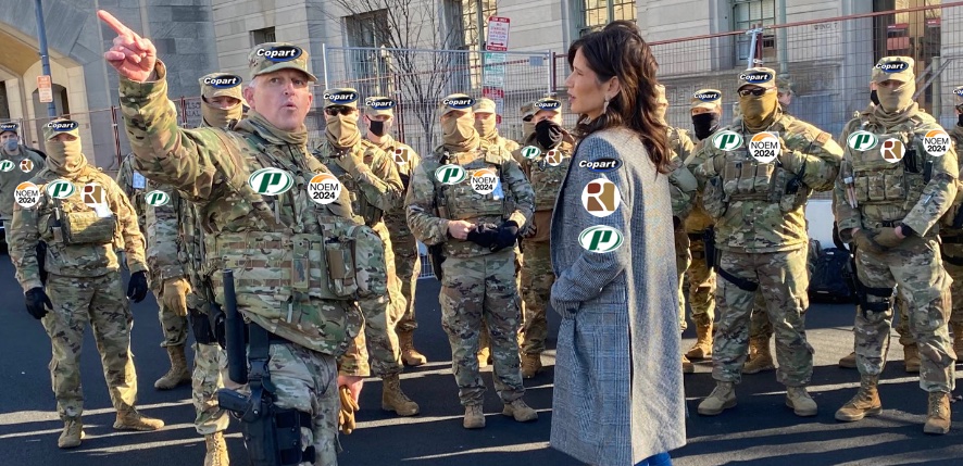 Noem and National Guard troops decked out in sponsors badges and Noem 2024 campaign patches