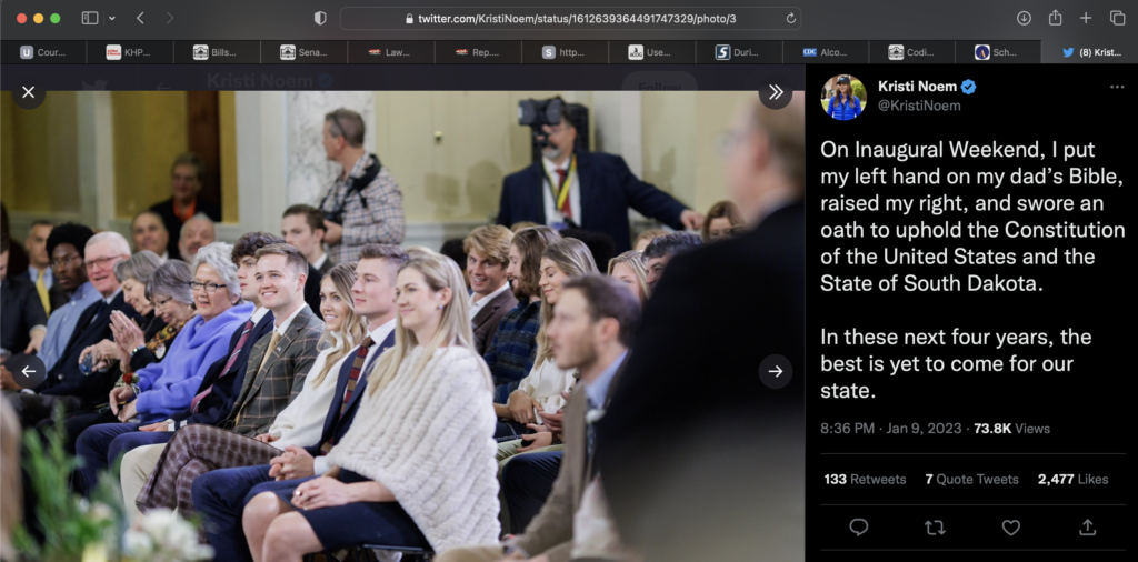 Kristi Noem, Twitter photo showing Corey Lewandowski at left, framed with Noem family at 2023 Inauguration, Pierre, SD, posted 2023.01.09.