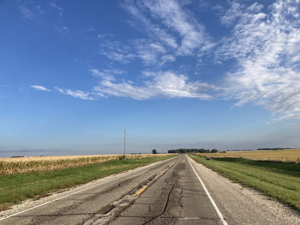 Wind at my back, farmland ahead, north of Storm Lake, Iowa.