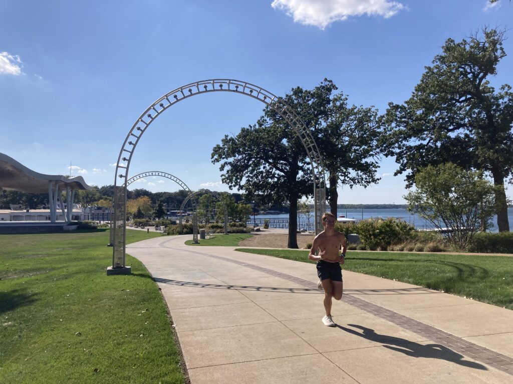 Arches on the promenade along Preservation Plaza, toward West Okoboji Lake. Work that hill, runner-man!