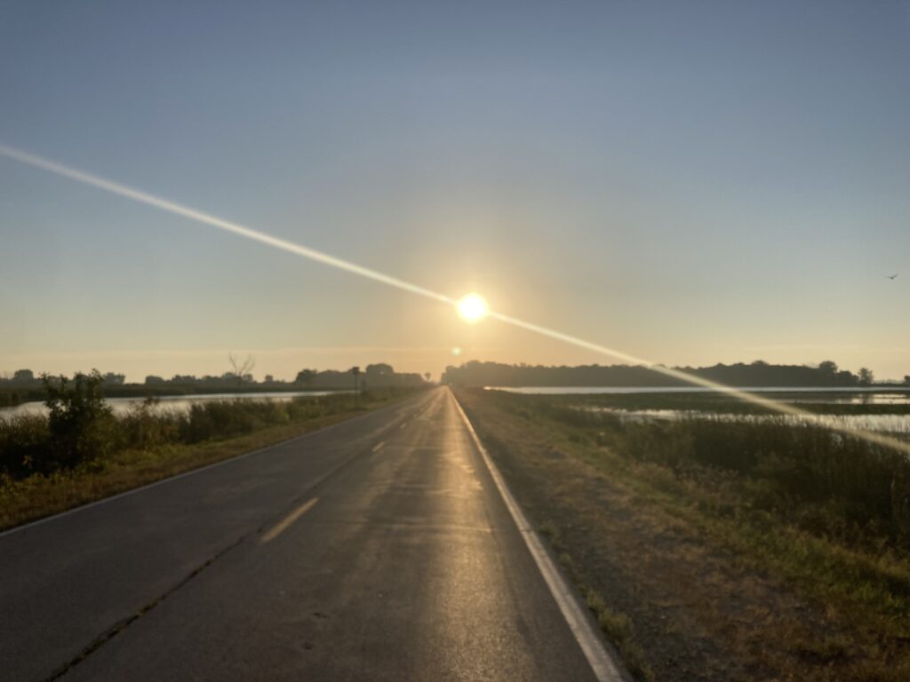 It’s been 20 years since I’ve bicycled into Minnesota. The three other times I’ve done it, I’ve crossed Minnesota’s western border, from South Dakota. This is the first time I’ve ridden into Minnesota from the south, from Iowa. North of Spirit Lake, I turn east, directly into the sun.