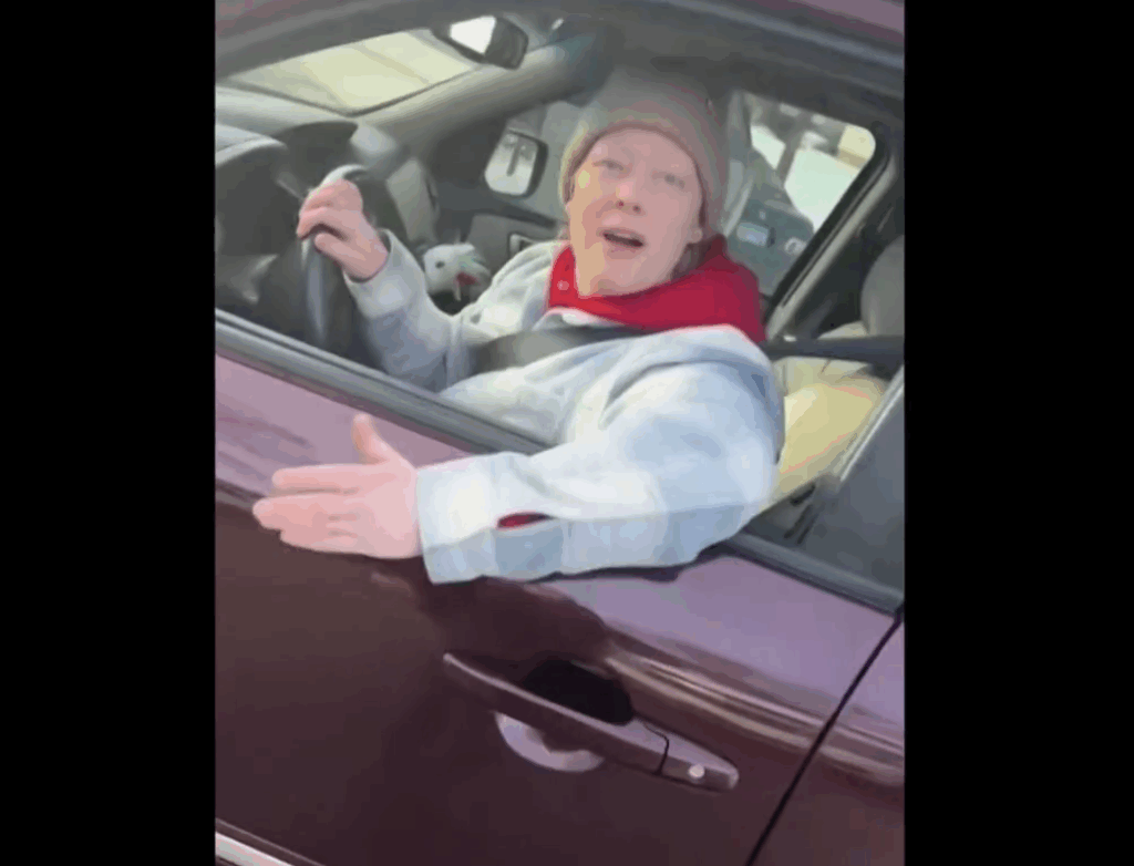 Renee Nicole Good, speaking to Jonathan Good from her car moments before he killed her, 2026.01.07. Screen cap from video apparently taken by Ross and posted by Alpha News, reposted by DHS, clipped her from AP, 2026.01.09.